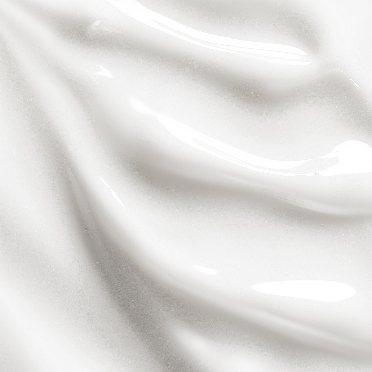 Close-up of white satin fabric with folds