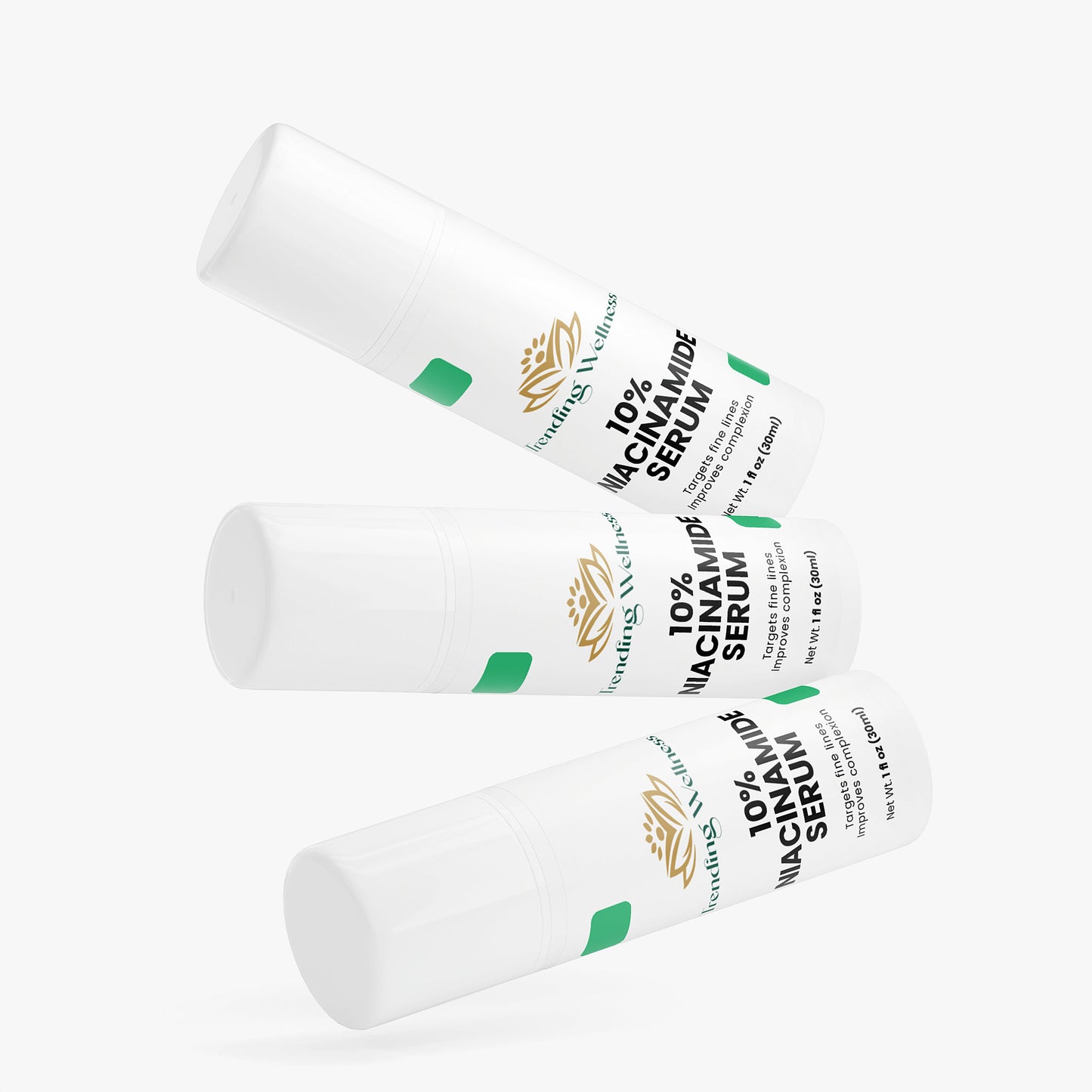 Three white serum bottles with green and black labels on a white background