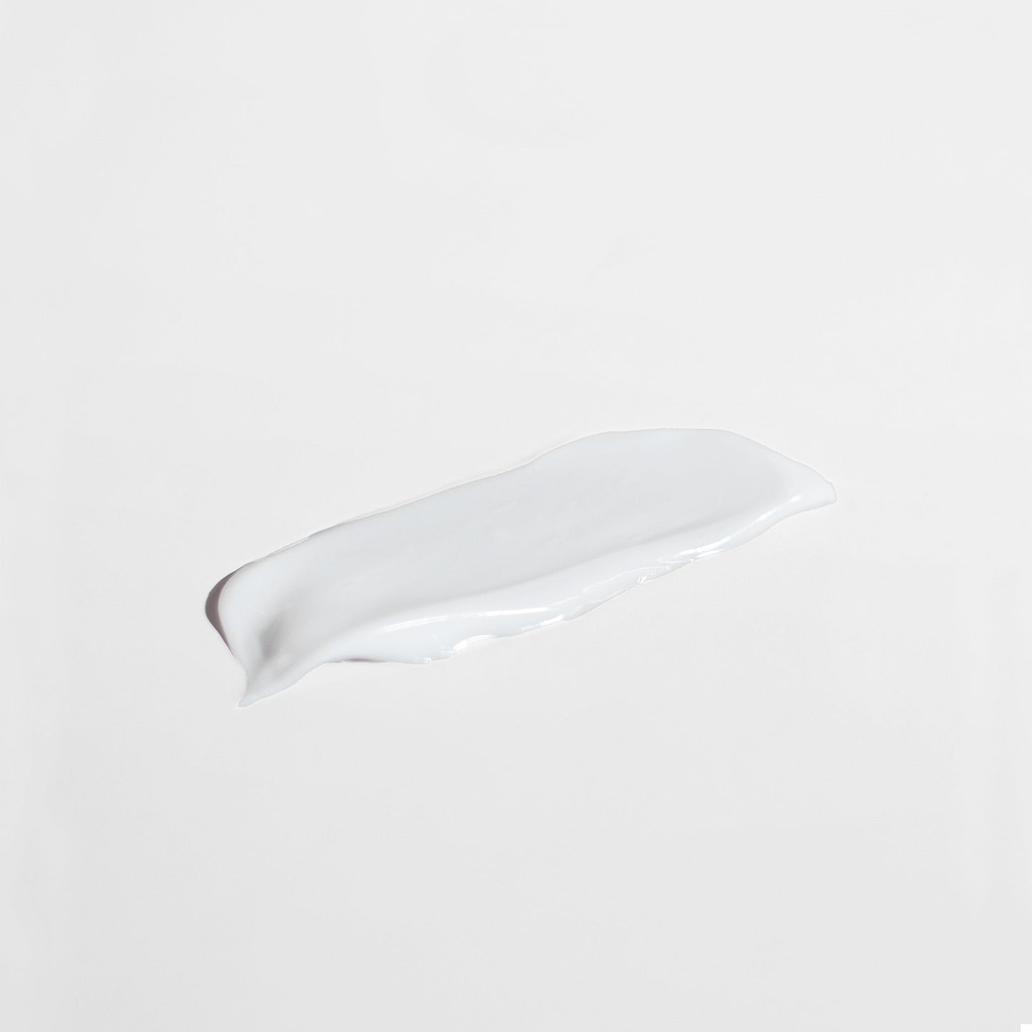 White ceramic spoon rest on a beige background