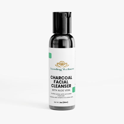 Bottle of charcoal facial cleanser with aloe vera on a white background