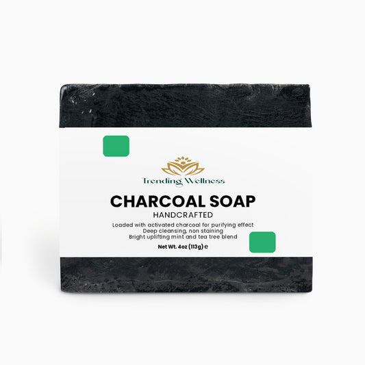 Bar of charcoal soap with a label on a white background