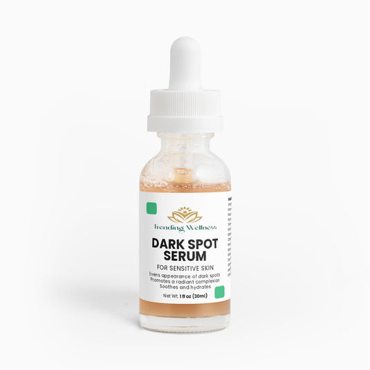 Bottle of dark spot serum with dropper on a white background