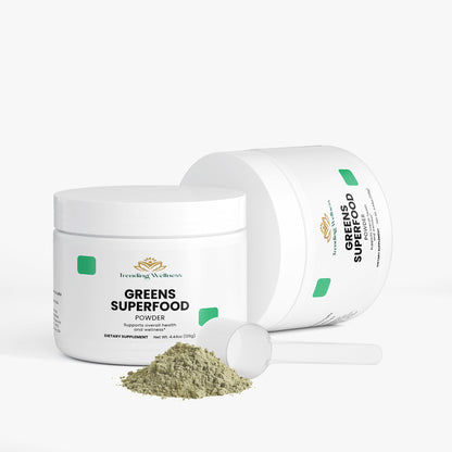 Jar of Greens Superfood Powder with scoop on a white background