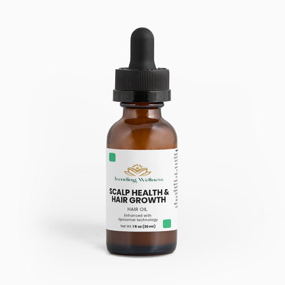 Bottle of scalp health and hair growth hair oil with a dropper on a white background