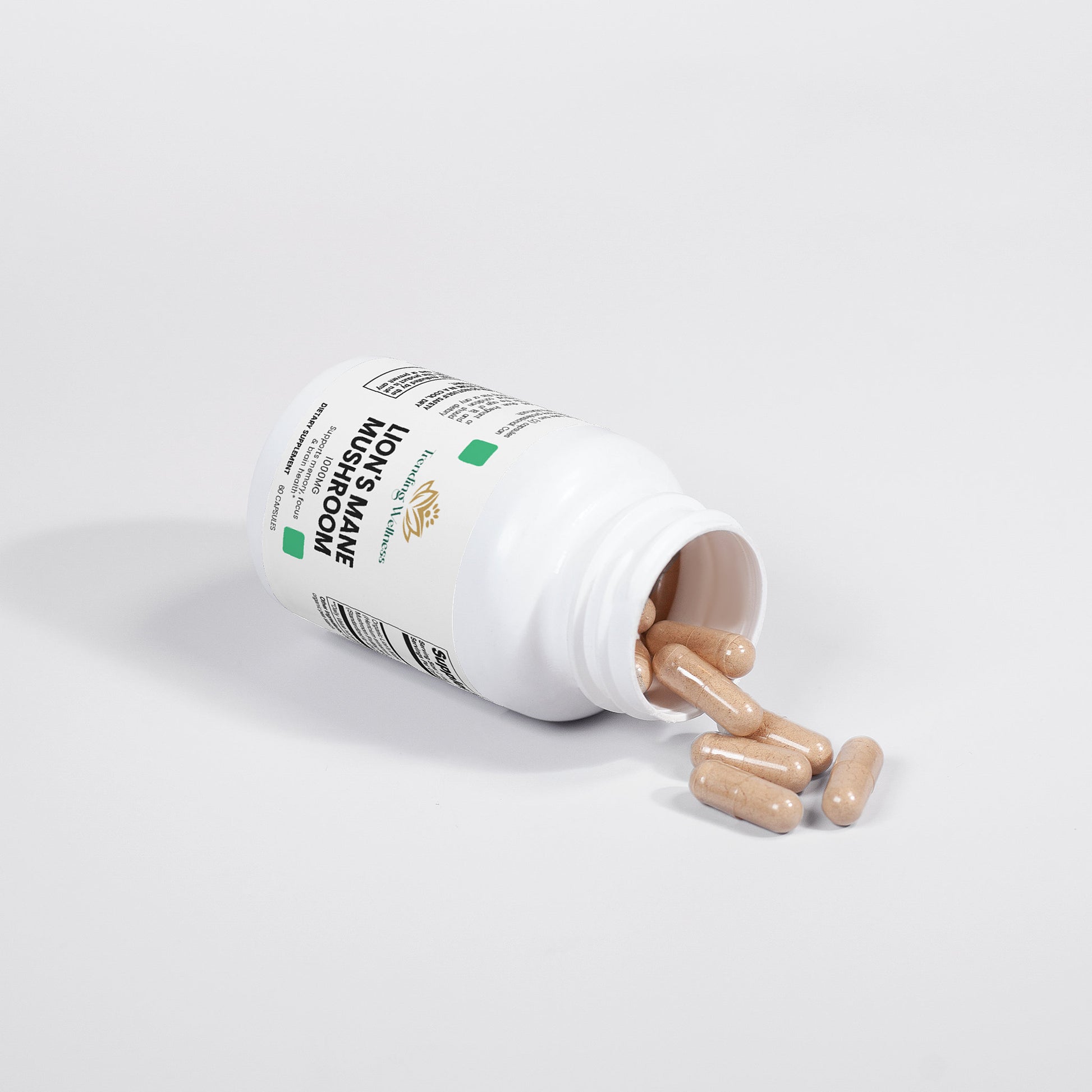 Open bottle of supplements with pills spilling out on a white background