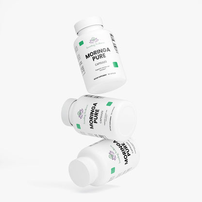 Three bottles of Moringa Pure capsules on a white background