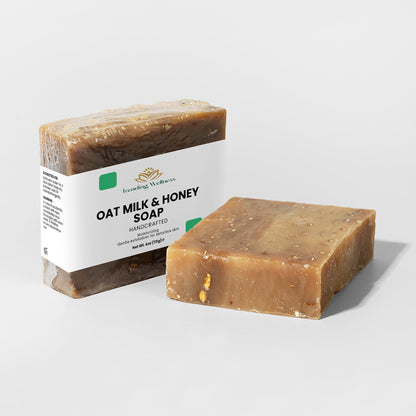 Two bars of oat milk and honey soap on a light gray background