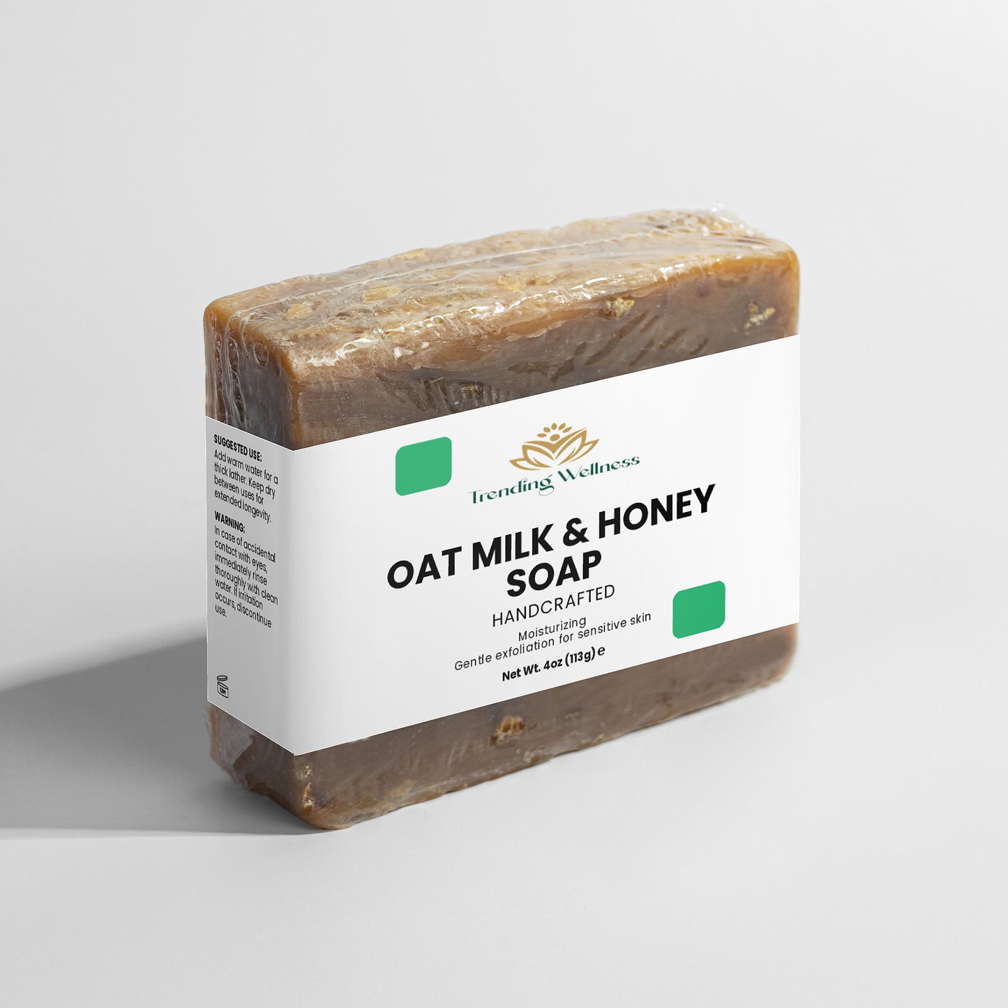 Oat milk and honey soap bar with a label on a light gray background