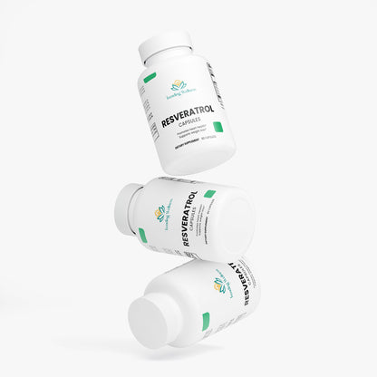 Three bottles of Resveratrol capsules on a white background