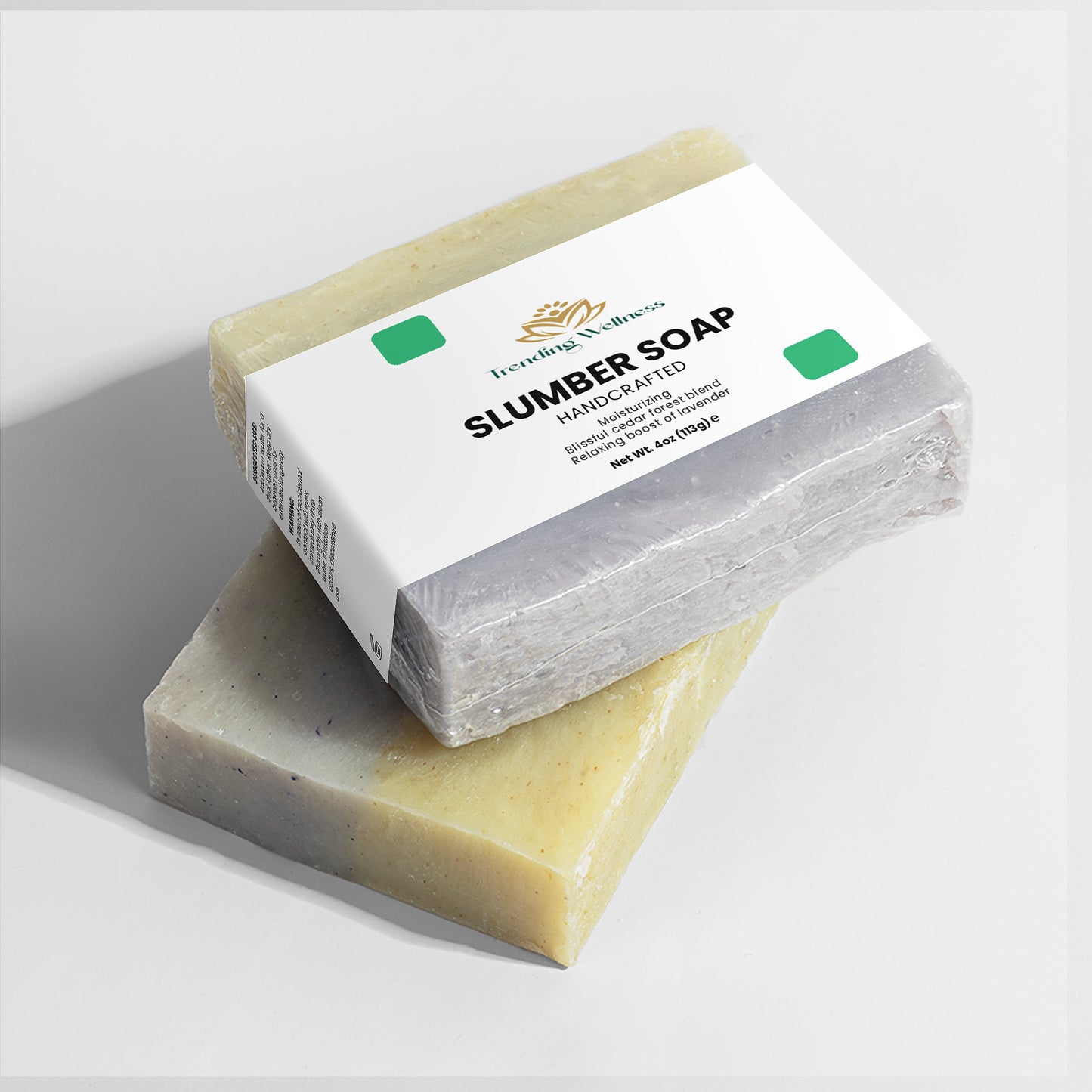 Two bars of soap with a box labeled 'Slumber Soap' on a light gray background