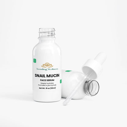 Snail mucin face serum bottle with dropper on a white background