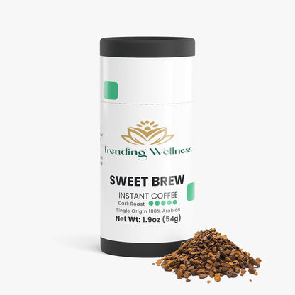 Trending Wellness Sweet Brew instant coffee canister with coffee grounds on a white background