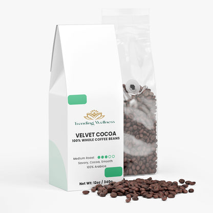 Bag of Trending Wellness Velvet Cocoa coffee beans with visible coffee beans on a white background