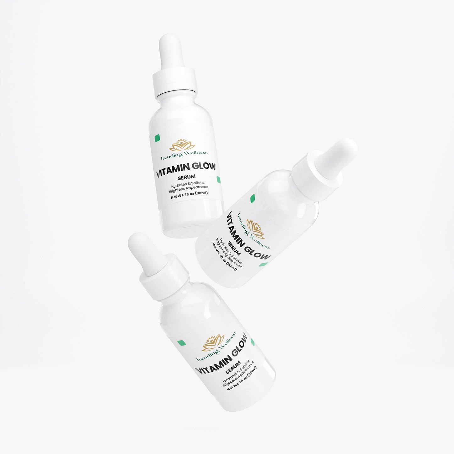 Three bottles of Vitamin Glow serum on a white background